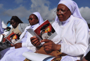 Nuns attend the beatification ceremony for a missionary nun, Sister Irene Stefani, who died in 1930 while working in the region, in Nyeri, 150km from the capital Nairobi, on May 23, 2015. Tens of thousands of Catholics prayed in the Kenyan town of Nyeri at a beatification ceremony of an Italian nun, the first person to undergo the key step toward sainthood in the east African country. AFP PHOTO 