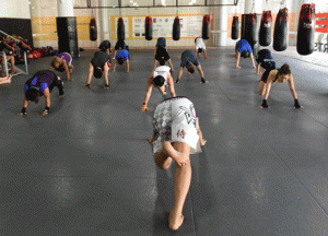 Working professionals using their lunch break to practice their mixed martial arts at the Evolve gym in Singapore. 