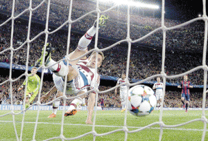 Bayern Munich’s Brazilian defender Rafinha fails to save a goal of Messi during the UEFA Champions League football match FC Barcelona vs FC Bayern Muenchen at the Camp Nou stadium in Barcelona. AFP PHOTO 