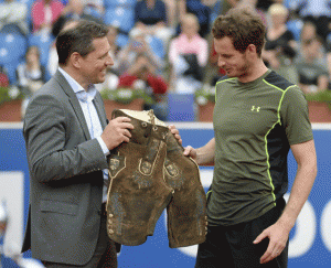 Britain’s Andy Murray (right) is presented with a Lederhosen, Bavarian leather trousers, during the award ceremony after his finals match against Germany’s Philipp Kohlschreiber during the ATP Tennis BMW Open in Munich, southern Germany. AFP PHOTO