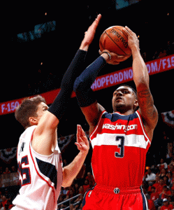 SHARP SHOOTER  Alanta, Georgia: Bradley Beal No.3 of the Washington Wizards draws a foul from Kyle Korver No.26 of the Atlanta Hawks during Game One of the Eastern Conference semifinals of the 2015 NBA Playoffs at Philips Arena in Atlanta, Georgia. AFP PHOTO