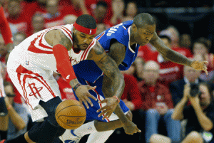 Josh Smith No.5 of the Houston Rockets battles for a loose basketball with Jamal Crawford No.11 of the Los Angeles Clippers during Game One in the Western Conference Semifinals of the 2015 NBA Playoffs at the Toyota Center in Houston, Texas. AFP PHOTO