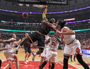 LeBron James No.23 of the Cleveland Cavaliers dunks over (first from right) Mike Dunleavy No.34, Jimmy Buter No.21 and Joakim Noah No.13 of the Chicago Bulls in Game Three of the Eastern Conference Semifinals of the 2015 NBA Playoffs at the United Center in Chicago, Illinois. AFP PHOTO