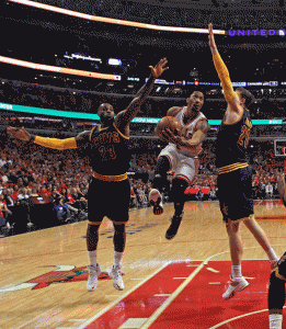 Derrick Rose, No.1 of the Chicago Bulls, drives between LeBron James No.23 and Timofey Mozgov No.20 of the Cleveland Cavaliers in Game Four of the Eastern Conference semifinals of the 2015 NBA playoffs at the United Center in Chicago, Illinois. AFP PHOTO