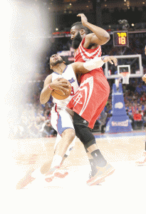 Chris Paul No.3 of the Los Angeles Clippers is fouled as he drives against James Harden No.13 of the Houston Rockets during Game Six of the Western Conference semifinals of the 2015 NBA Playoffs at Staples Center in Los Angeles, California. AFP PHOTO