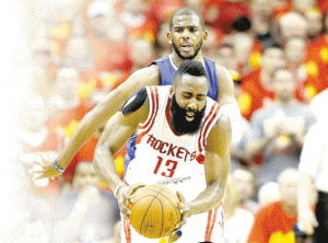 Chris Paul No.3 of the Los Angeles Clippers defends against James Harden No.13 of the Houston Rockets in the fourth quarter during Game Seven of the Western Conference Semifinals at the Toyota Center for the 2015 NBA Playoffs in Houston, Texas.  AFP PHOTO