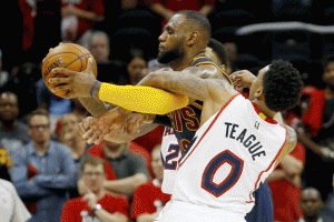 Jeff Teague No.0 of the Atlanta Hawks tries to strip the ball from LeBron James No.23 of the Cleveland Cavaliers in the second half during Game One of the Eastern Conference Finals of the 2015 NBA Playoffs at Philips Arena in Atlanta, Georgia. AFP PHOTO