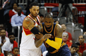 Mike Scott No. 32 of the Atlanta Hawks and LeBron James No.23 of the Cleveland Cavaliers vie for possession of the ball in the fourth quarter during Game Two of the Eastern Conference Finals of the 2015 NBA Playoffs at Philips Arena in Atlanta, Georgia. AFP PHOTO