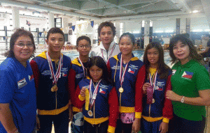 (from left) Philippine Swimming League President Susan Papa, Sean Terence Zamora, Stephen Guzman, Micaela Jasmine Mojdeh, Roger Dante Giron, Charize Juliana Esmero, Kyla Soguilon and Secretary General Maria Susan Benasa. CONTRIBUTED PHOTO