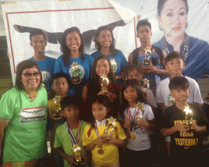 Philippine Swimming League (PSL) President Susan Papa with the Most Outstanding Swimmer awardees in Novice Category of the 76th PSL National Series. CONTRIBUTED PHOTO