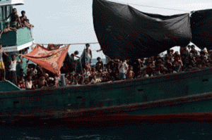 Picture taken on May 14 shows Rohingya migrants on a boat drifting in Thai waters off the southern island of Koh Lipe in the Andaman. Trafficking experts say Thailand is the centre of a multi-million-dollar trade run by competing transnational criminal syndicates. AFP PHOTO