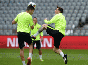 Barcelona’s Argentinian forward Lionel Messi (right) and Barcelona’s midfielder Andres Iniesta play the ball during the final team training session on the eve of the second leg UEFA Champions League semifinals second leg match between FC Bayern Munich and FC Barcelona at the Bayern Munich trainings area in Munich, southern Germany. AFP PHOTO