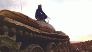 GUNS TO GO SILENT SOON  An armed Yemeni tribesman from the Popular Resistance Committees supporting forces loyal to Yemen’s Saudi-backed fugitive President Abedrabbo Mansour Hadi sits on a tank at sunset as they continue to battle Shiit Huthi rebels in the area of Jaadan, in Marib province east of the capital, Sanaa, on Saturday.  AFP PHOTO