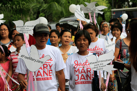 Caesar and Celia Veloso, parents of overseas Filipino worker (OFW) Mary Jane Veloso, join members of party-list group Garbriela in a march around Quezon City Memorial Circle in Quezon City on Sunday as part of their “Justice Walk” calling on the government to bring Mary Jane home. The march also marked Mother’s Day. The OFW is on death row in Indonesia for drug smuggling. PHOTO BY MIGUEL DE GUZMAN