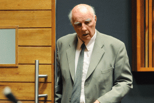 Australian-born former tennis Grand Slam champion Bob Hewitt walking through the Palm Ridge court where he was found guilty of rape and indecent assault in Johannesburg.  AFP PHOTO