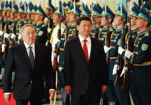 ‘BIG FRIEND’  Kazakh President Nursultan Nazarbayev (L) and his Chinese counterpart Xi Jinping (C) walk past an honor guard during a welcoming ceremony in Astana on May 7, 2015. Xi Jinping is on his one-day visit to Kazakhstan. AFP PHOTO