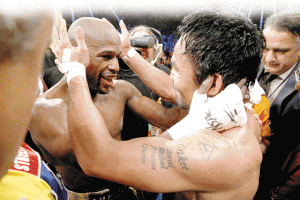 Floyd Mayweather Jr., hugs Manny Pacquiao after defeating Pacquiao in their welterweight  unification bout at the MGM Grand Garden Arena in Las Vegas, Nevada.  AFP PHOTO