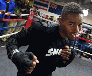 Boxer Willie Monroe of the US warms up during a workout before his Middleweight World Championship bout against Gennady Golovkin from Kazakhstan at the Wild Card West Boxing Gym in Santa Monica, California.  AFP PHOTO 