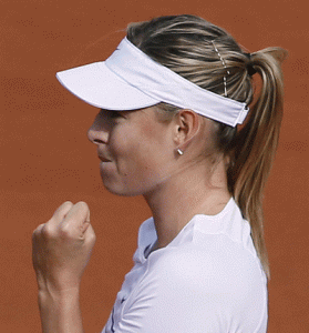 Maria Sharapova celebrates after winning her match against Estonia’s Kaia Kanepi during the women’s first round of the Roland Garros 2015 French Tennis Open in Paris. AFP PHOTO