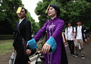 Participants take part in a 'zombie walk' at a park in Tokyo on May 16, 2015. Some 100 zombie maniacs flocked to a Tokyo park for an annual gathering, dressing in 