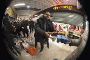 Courbevoie's right-wing local representative, Arash Derambarsh, distributing food in Courbevoie, outside Paris. The local councilor, whose zealous anti-waste campaign led to a French law forcing supermarkets to give leftover food to charity, is preparing a petition to take the legislation Europe-wide. AFP PHOTO