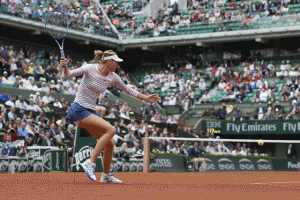 Russia’s Maria Sharapova returns the ball to Australia’s Samantha Stosur during the women’s third round at the Roland Garros 2015 French Tennis Open in Paris on Saturday