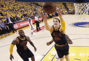 Timofey Mozgov no.20 of the Cleveland Cavaliers reaches for the ball in the first half against the Golden State Warriors during Game Two of the 2015 NBA Finals at Oracle Arena on Monday in Oakland