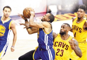 Andre Iguodala no.9 of the Golden State Warriors goes up against LeBron James no.23 of the Cleveland Cavaliers in the third quarter during Game Four of the 2015 NBA Finals at Quicken Loans Arena on Friday in Cleveland, Ohio.  AFP PHOTO