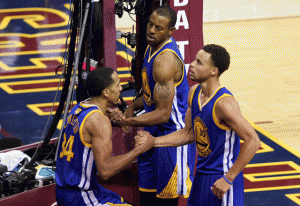 Andre Iguodala No.9, and Stephen Curry No.30, help Shaun Livingston No.34 of the Golden State Warriors to his feet during Game Four of the 2015 NBA Finals against the Cleveland Cavaliers at Quicken Loans Arena in Cleveland on Friday. AFP PHOTO