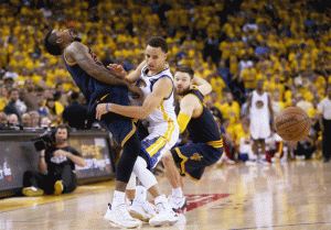 Stephen Curry No.30 of the Golden State Warriors collides with J.R. Smith No.5 of the Cleveland Cavaliers in the fourth quarter during Game Five of the 2015 NBA Finals at Oracle Arena on Monday in Oakland. AFP PHOTO
