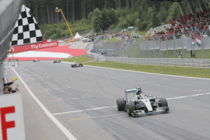 Mercedes AMG Petronas F1 Team’s German driver Nico Rosberg crosses the finish line of the Red Bull Ring in Spielberg, Austria on June 21, 2015, during the Austrian Formula One Grand Prix. Germany’s Nico Rosberg won the Austrian Grand Prix ahead of British teammate and overall drivers standings leader Lewis Hamilton, with Brazilian Felipe Massa, in a Williams, in third 17sec off the pace. AFP PHOTO