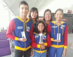 Most Outstanding Swimmer awardees Sean Terence Zamora, Micaela Jasmine Mojdeh and Charize Juliana Esmero display their trophies with Philippine Swimming League President Susan Papa and Secretary General Maria Susan Benasa. CONTRIBUTED PHOTO