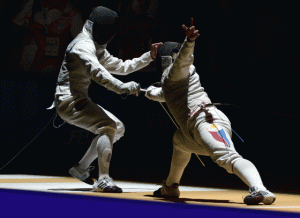 Nathaniel Perez (right) of the Philippines competes with Indonesia’s Dennis Ariadinata Satriana in their fencing men’s individual foil quarterfinals match during the 28th Southeast Asian Games in Singapore. Perez won the bronze medal.  AFP PHOTO