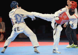 Trung Duc Phan of Vietnam (left) competes against Samuel Thomas Morrison of Philippines during the men’s under 68kg taekwondo finals at the 28th Southeast Asian Games (SEA Games) in Singapore on Sunday. AFP PHOTO