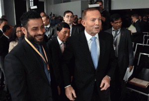 FIGHTING BACK  Australian Prime Minister Tony Abbott (R) meets with delegates following his speech at the Regional Countering Violent Extremism Summit in Sydney on June 11, 2015. Tony Abbott urged Asia-Pacific nations to help fight jihadist groups as he opened a regional summit on the issue with a warning that Islamic State has global ambitions. AFP PHOTO