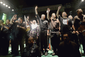 OPPOSITION COLLAPSES  This file photo taken on May 12, 2013 shows opposition leader Anwar Ibrahim (C) and his coalition candidates waving to the crowd during a protest rally in Ipoh, Perak state in a series of protest gatherings. The Malaysian opposition political alliance that had threatened to unseat the country’s long-ruling regime is no more, one of its three component parties declared on June 16, 2015, following bitter disputes over policy. AFP PHOTO