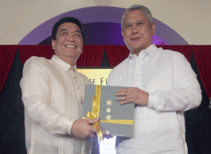 PAPAL BOOK  The Manila Times’ President and CEO Dante Ang 2nd receives a copy of the coffee table book from Fr. Herminio Dagohoy. PHOTO BY RUY L. MARTINEZ