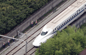 SHINKANSEN DEATHS  This aerial view shows a Nozomi 255 bullet train, or “shinkansen”, stopped near the Odawara station on June 30, 2015 after an apparent suicide attempt on board. A man set himself on fire on board the train, killing himself and one other person and injuring others, in an unprecedented incident on the vast rail network that has an enviable safety record. AFP PHOTO