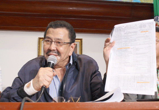 Manila Mayor Joseph Estrada on Thursday during a news conference shows the building permit signed by his predecessor Alfredo Lim for the construction of Torre de Manila, a condominium project of the Consunji group in Malate district. A temporary restraining order was recently issued against the project over protests from heritage groups and other concerned sectors that the high-rise, even if still unfinished, already is an eyesore of a background for every photograph taken of the Rizal monument in Manila’s Rizal Park (Luneta). PHOTO BY MELYN ACOSTA