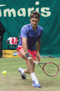 Roger Federer of Switzerland returns the ball to Latvia’ Ernests Gulbis during the ATP Gerry Weber Open round of sixteen tennis match in Halle, western Germany on Thursday. AFP PHOTO