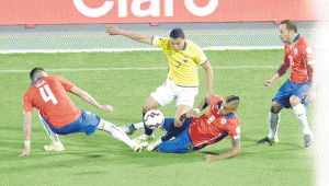 Ecuador’s midfielder Jefferson Montero (center) struggles for the ball with Chile’s defender Mauricio Isla, Chile’s midfielder Arturo Vidal and Chile’s midfielder Marcelo Diaz (left to right) during the Copa America inauguration match, on Friday at the National stadium in Santiago.  AFP PHOTO