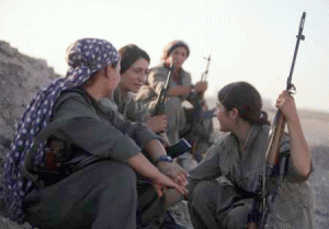 WARRIOR WOMEN  A picture taken on August 21, 2014 shows women Kurdistan Workers Party (PKK) fighters resting as they patrol the front line in the Makhmur area, near Mosul, Iraq. AFP PHOTO