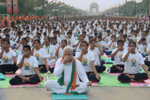 YOGA MINISTER  Indian Prime Minister Narendra Modi(C) participates in a mass yoga session along with other Indian oga practitioners to mark the International Yoga Day on Rajpath in New Delhi on June 21, 2015. AFP PHOTO