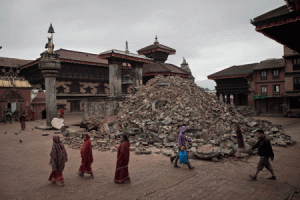 RUBBLE OF HISTORY  IN this photograph taken on April 30, 2015, pedestrians walk past damaged temples at the UNESCO world heritage site of Bhaktapur on the outskirts of the Nepalese capital Kathmandu, following a 7.8 magnitude earthquake which struck the Himalayan nation on April 25. Nepal reopened its temple-filled Durbar Squares to the public on June 15, 2015, despite warnings over safety, seeking to woo back tourists after a deadly earthquake that left much of the country’s cultural heritage in ruins. AFP PHOTO