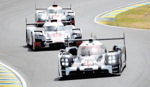 Swiss’ Neel Jani steers his Porsche 919 - Hybrid N°18 ahead France’s Loic Duval on his Audi R18-E-Tron Quattro Hybrid N°8 and Germany’s Andre Lotterer on his Audi R18-E-Tron Quattro Hybrid N°7 during the 83rd Le Mans 24- hours endurance race, in Le Mans, France on Sunday.  AFP PHOTO 