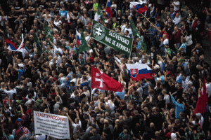 BUT NOT IN SLOVAKIA  Participants wave flags and hold a banner reading “Slovakia is not Africa” during an anti-immigration rally organized by an initiative called “Stop Islamization of Europe” and backed by the far-right “People’s Party-Our Slovakia” on June 20, 2015 in Bratislava, Slovakia.  AFP PHOTO