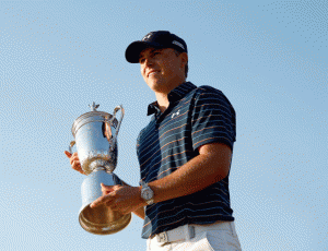 Jordan Spieth of the United States poses with the trophy for photographers after winning the 115th U.S. Open Championship at Chambers Bay on Monday in University Place, Washington. AFP PHOTO