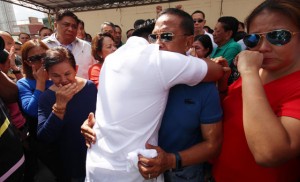 SHOULDER TO CRY ON An emotional Makati City Mayor Jejomar Erwin Binay Jr. (back to camera) finds solace in the arms of  his father, Vice President Jejomar Binay.  PHOTO BY RUY MARTINEZ 