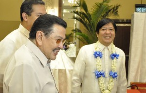 LONGTIME ALLIES Deposed president now Manila Mayor Joseph Estrada and Sen. Ferdinand Marcos Jr. share a laugh as they pose for pictures at the Philippine Constitution Association meeting. PHOTO BY BONG RANES