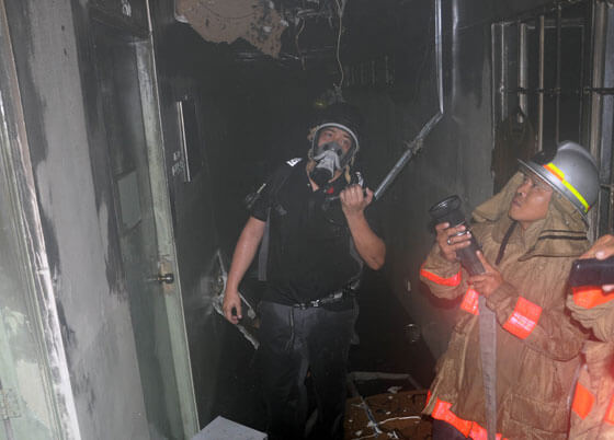  Firefighters inspect a room at the Philippine Drug Enforcement Agency that was damaged by fire. The blaze that started at the second floor reached third alarm before it was put out. PHOTO BY MIKE DE JUAN 